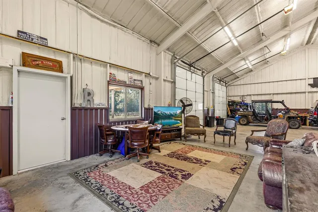 a living room with furniture a wooden floor and chandelier