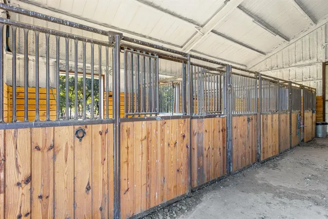 a bedroom with furniture and a chandelier