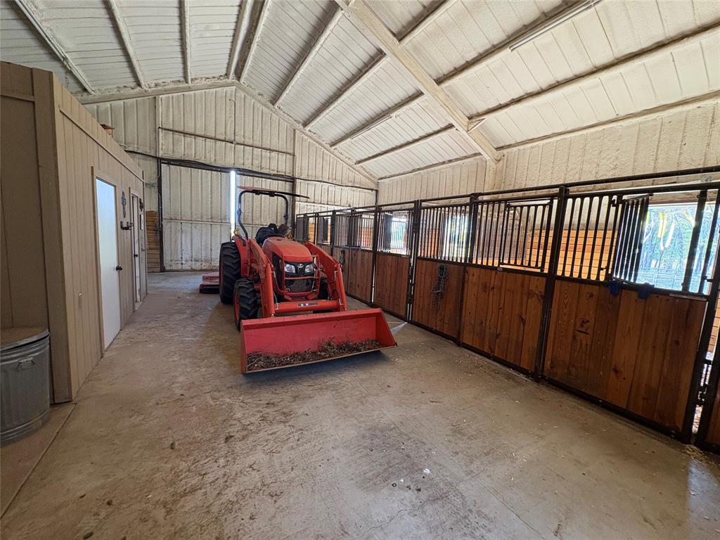 1094-2 Southwest Sw Cr Saltillo, TX 75478 - Photo 24 of 39 a bedroom with furniture and a chandelier