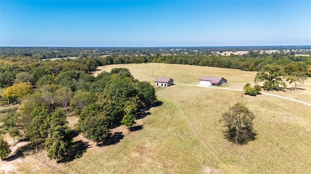 1094-2 Southwest Sw Cr Saltillo, TX 75478 - Photo 4 of 39 an aerial view of ocean and trees
