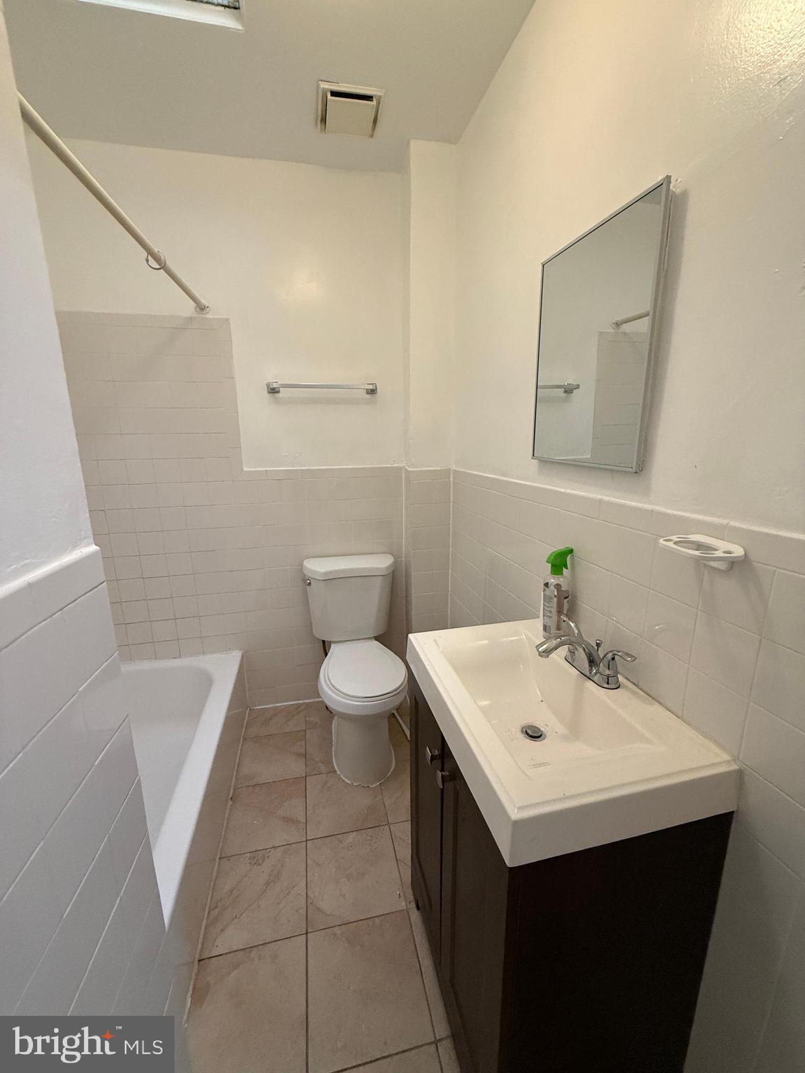 3309 Brighton Street Baltimore, MD 21216 - Photo 21 of 32 a bathroom with a sink and a toilet