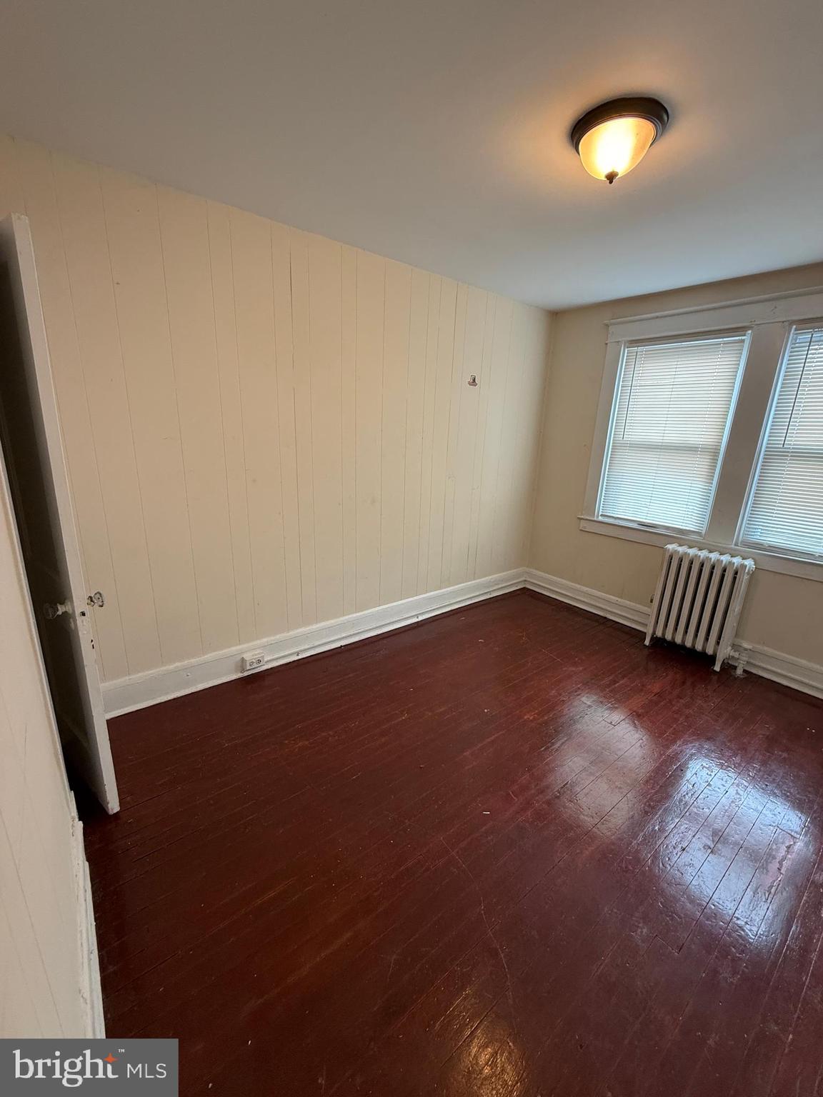 3309 Brighton Street Baltimore, MD 21216 - Photo 22 of 32 an empty room with a window