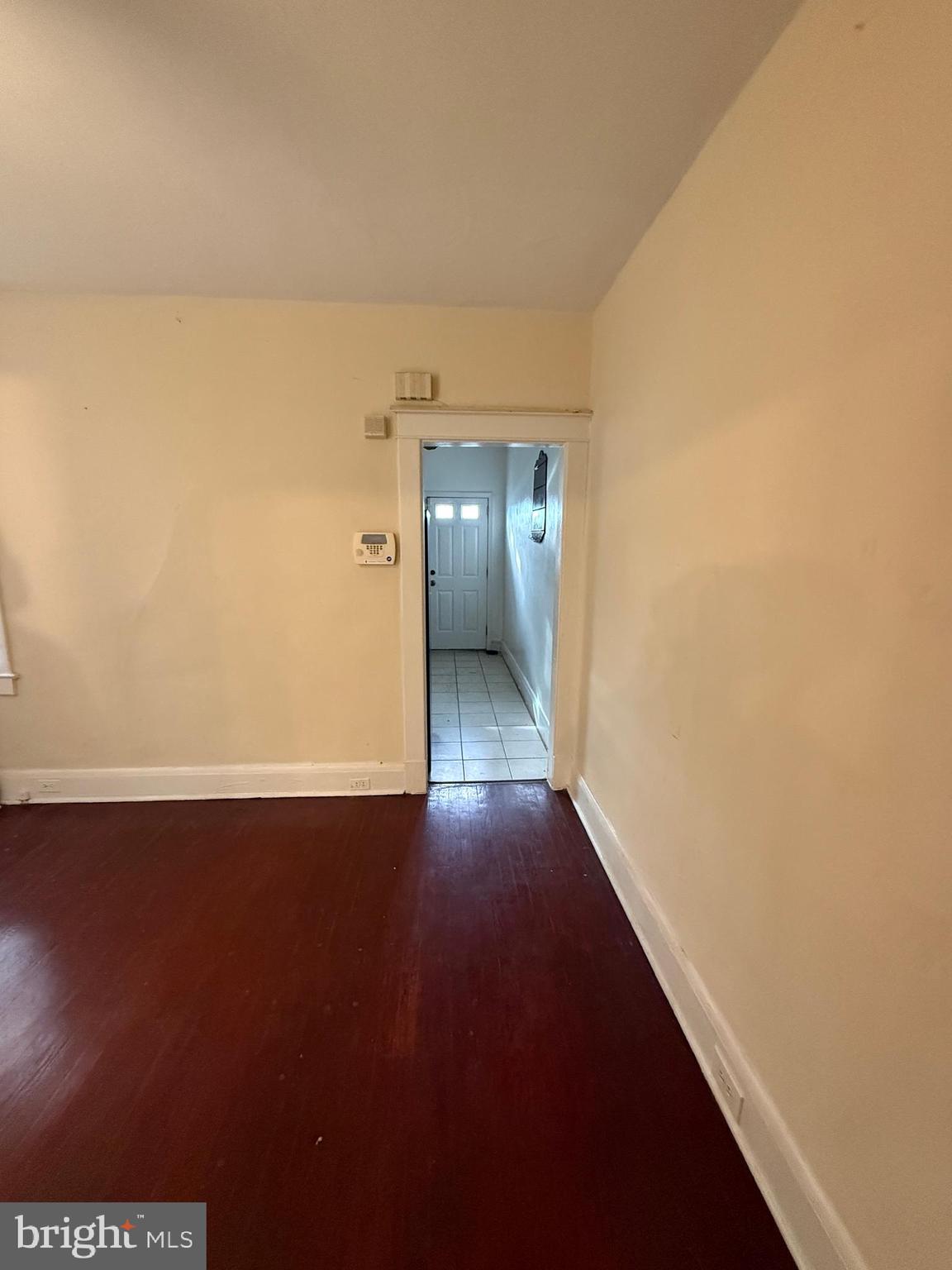 3309 Brighton Street Baltimore, MD 21216 - Photo 25 of 32 a view of an empty room and wooden floor