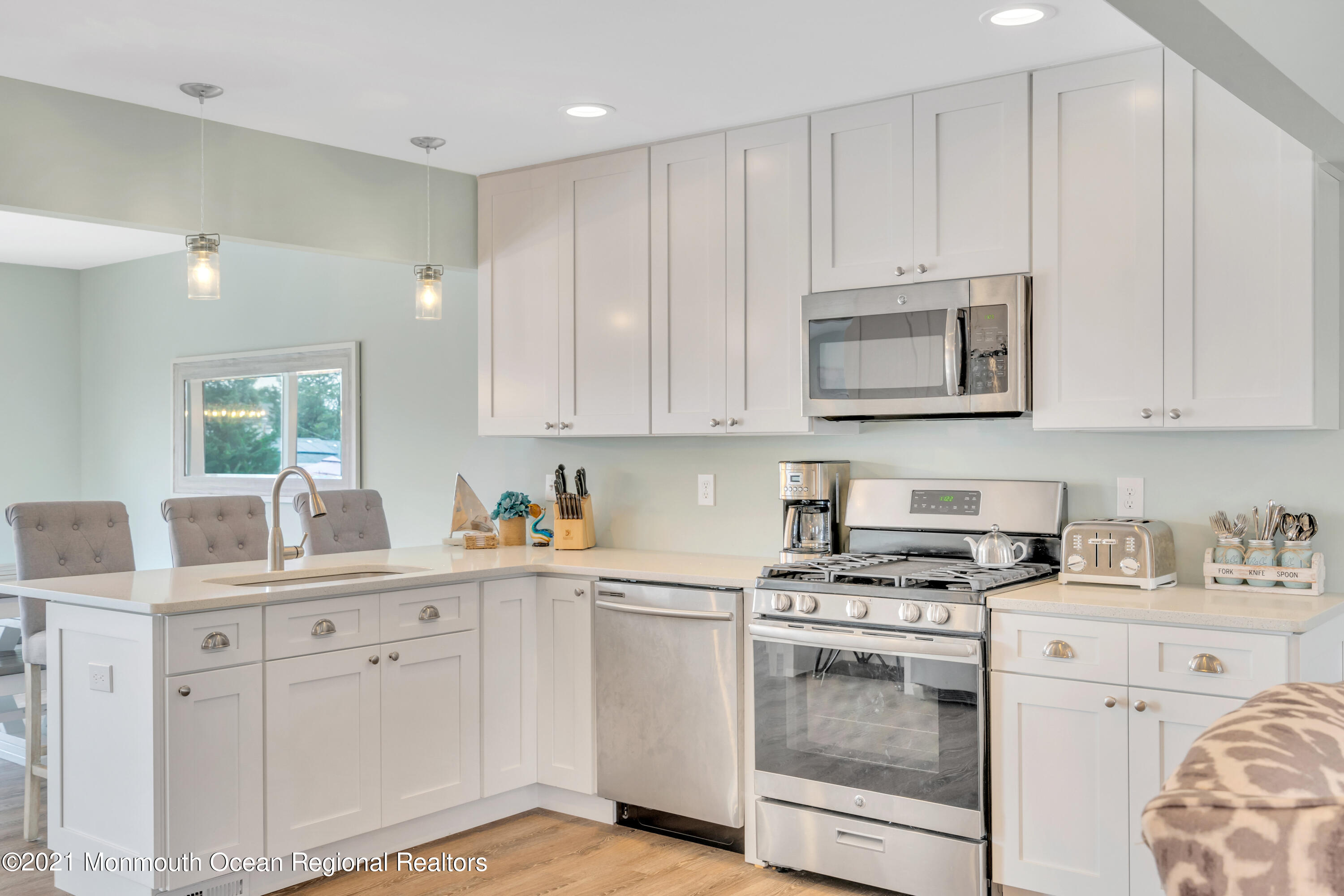 28 Harbor Inn Road Bayville, NJ 08721 - Photo 13 of 52 a kitchen with cabinets appliances a sink and a counter space