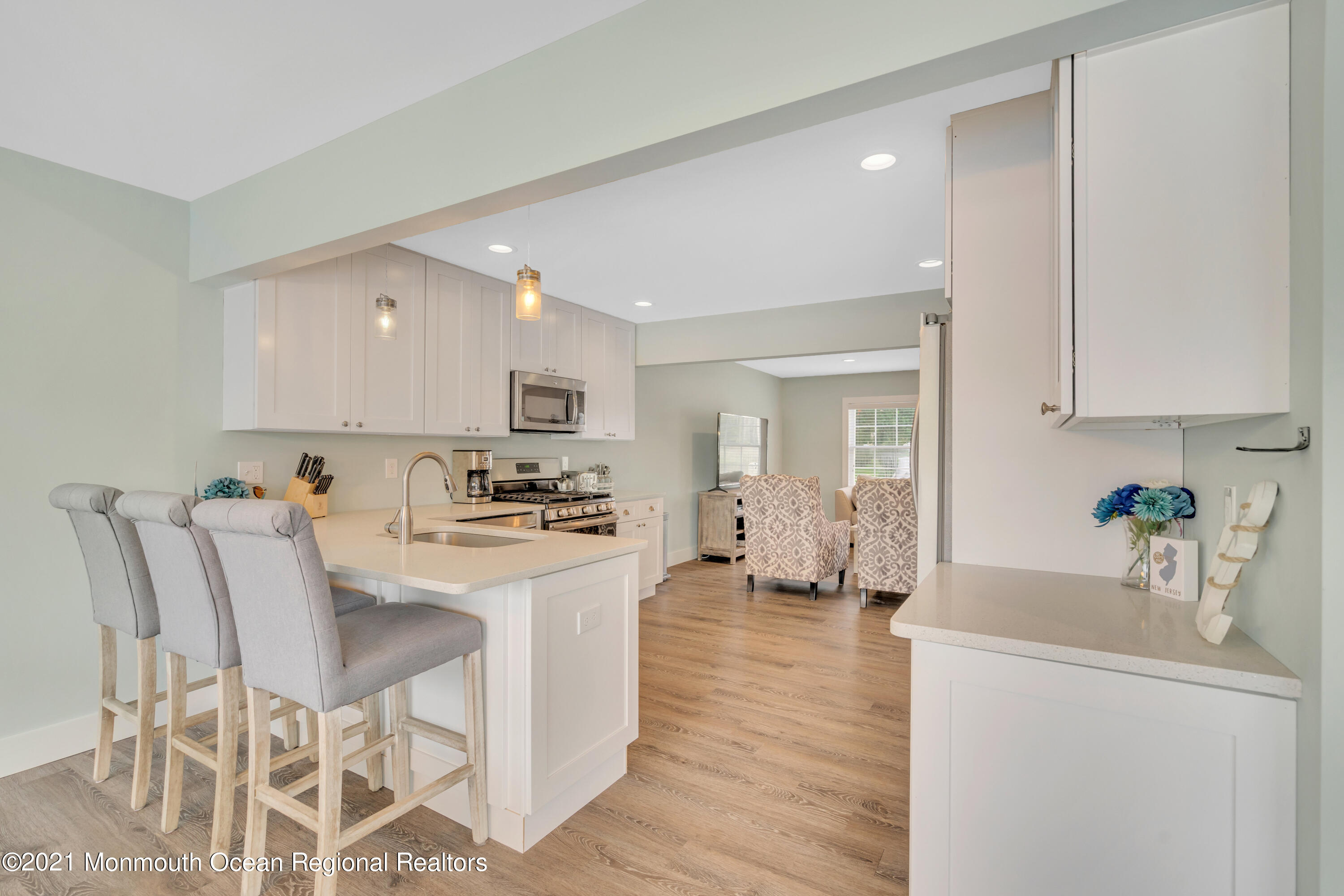 28 Harbor Inn Road Bayville, NJ 08721 - Photo 17 of 52 a large white kitchen with sink and white cabinets