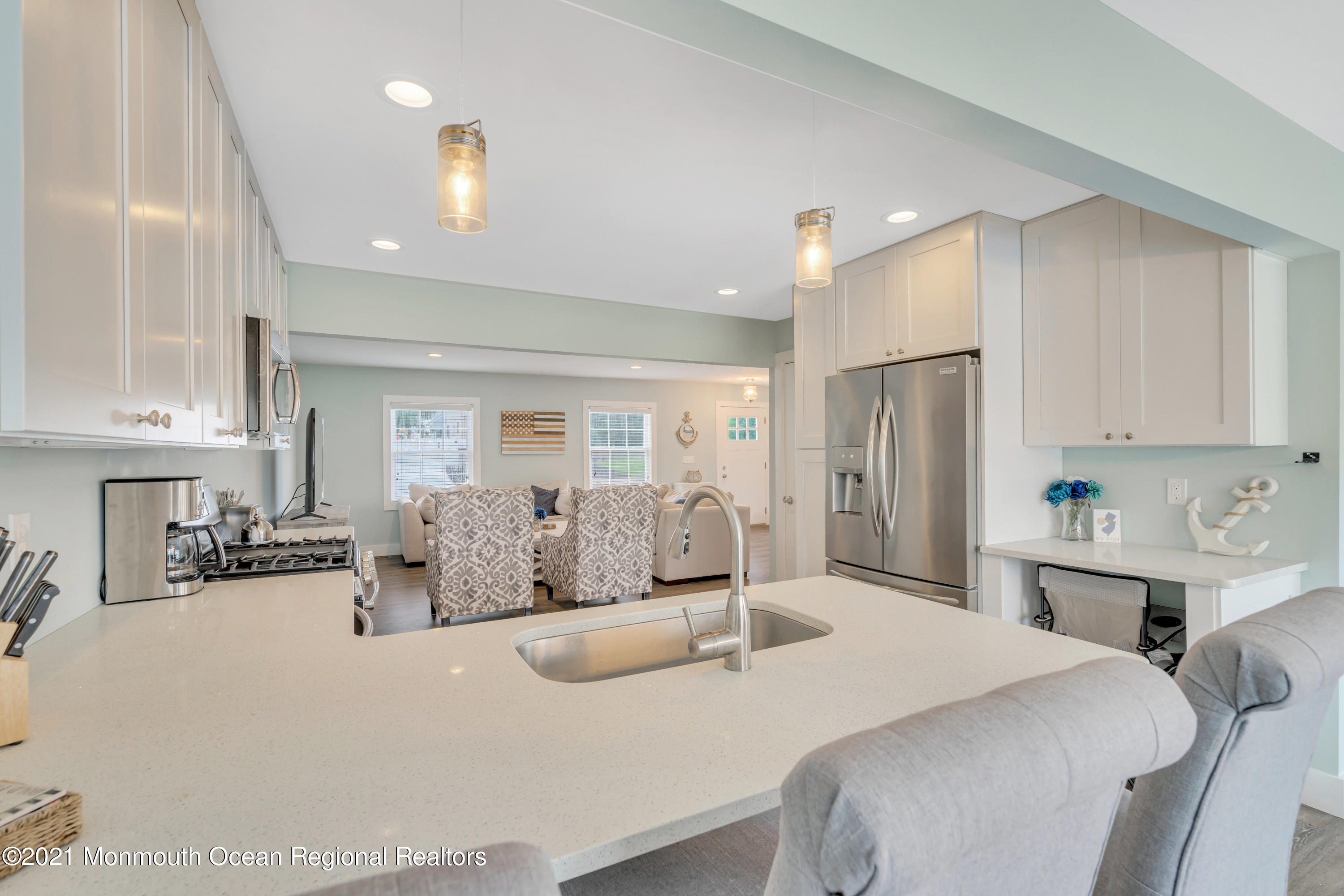 28 Harbor Inn Road Bayville, NJ 08721 - Photo 19 of 52 a large bedroom with a bed a table and chairs