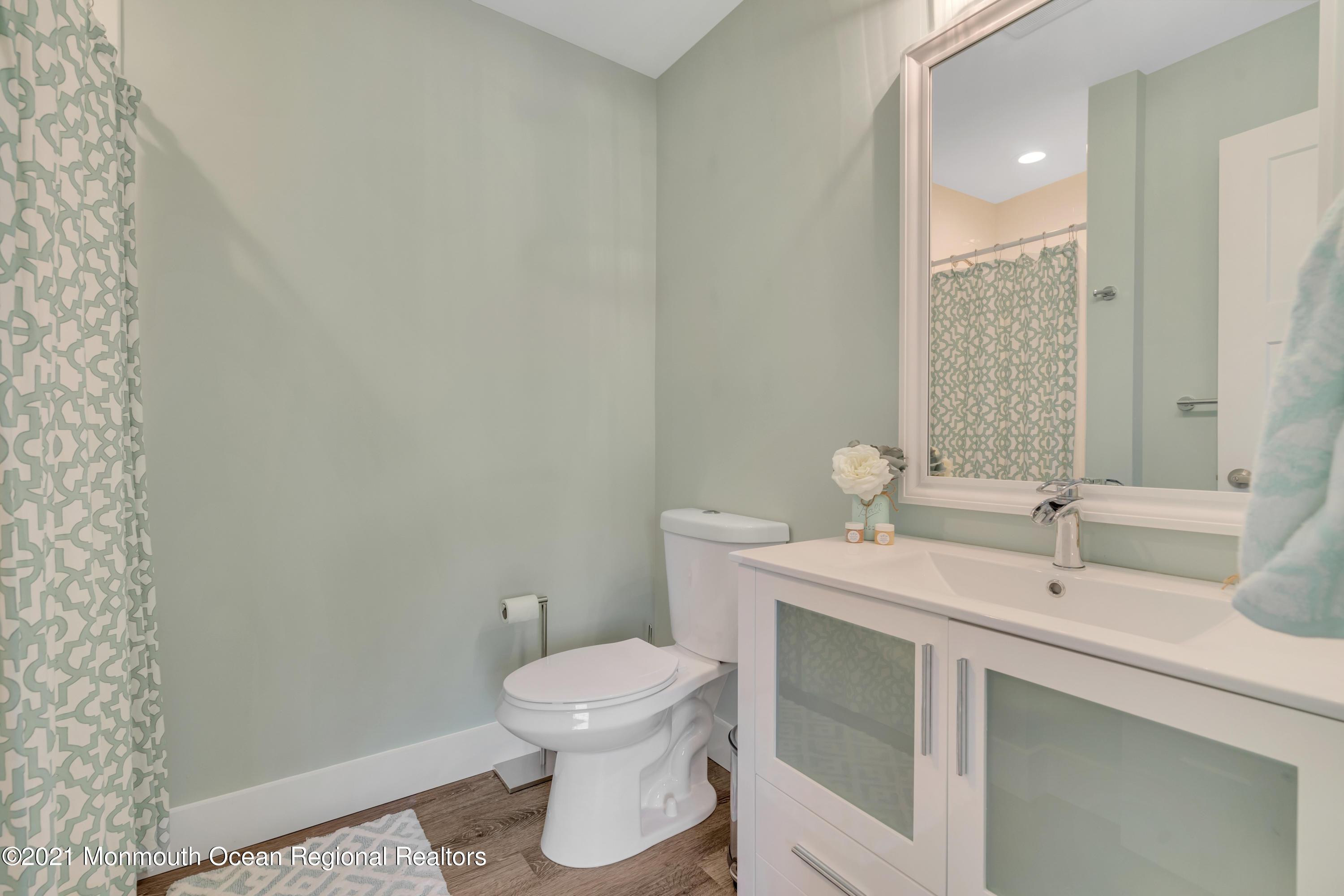 28 Harbor Inn Road Bayville, NJ 08721 - Photo 32 of 52 a bathroom with a toilet sink and mirror