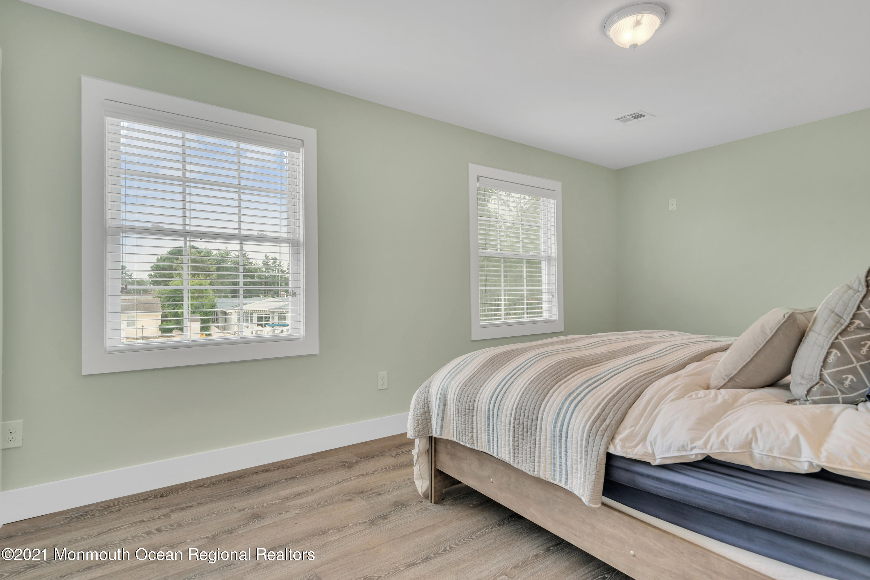 28 Harbor Inn Road Bayville, NJ 08721 - Photo 37 of 52 a bedroom with a bed and a window