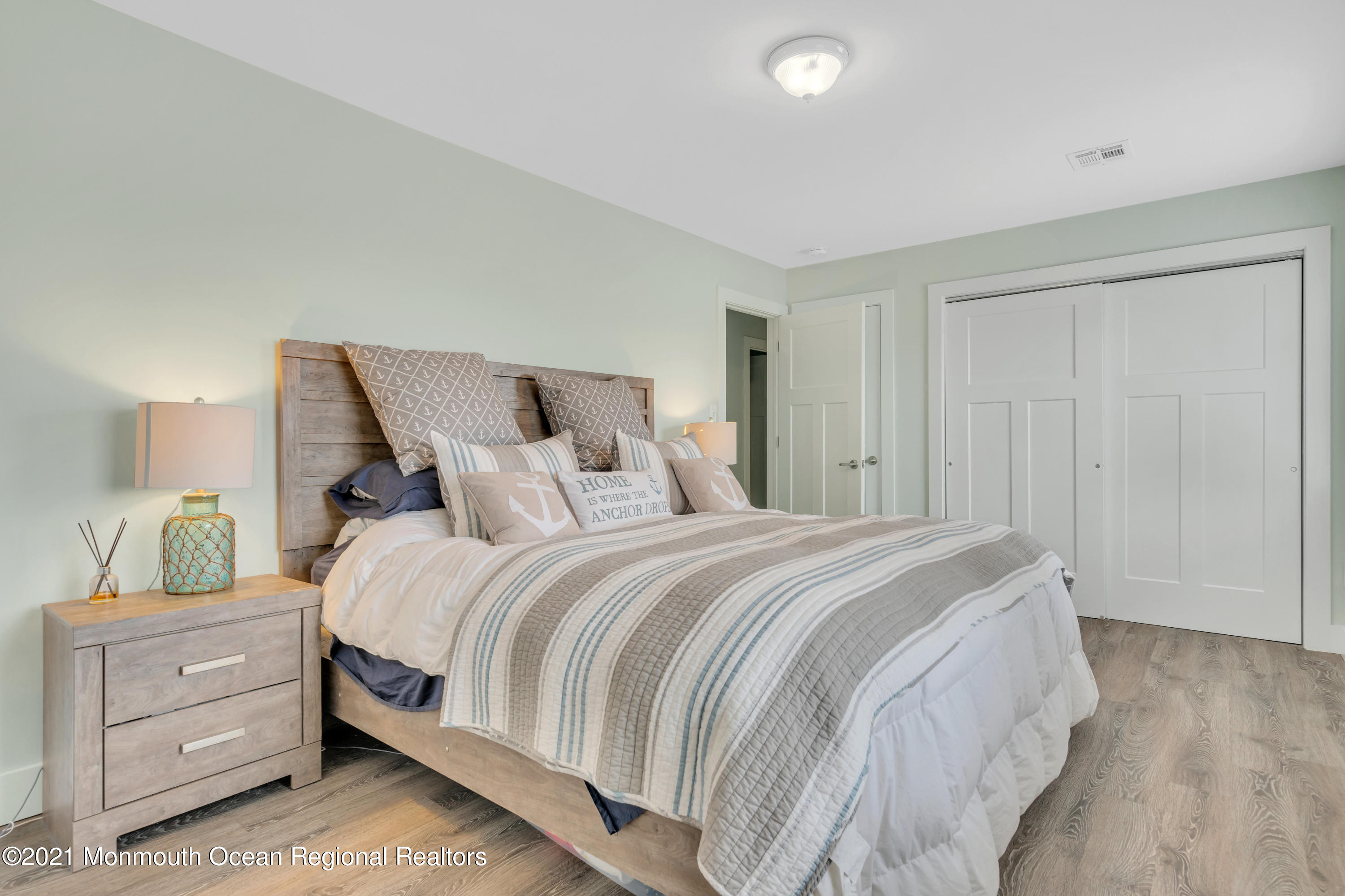 28 Harbor Inn Road Bayville, NJ 08721 - Photo 38 of 52 a bedroom with a bed and a window