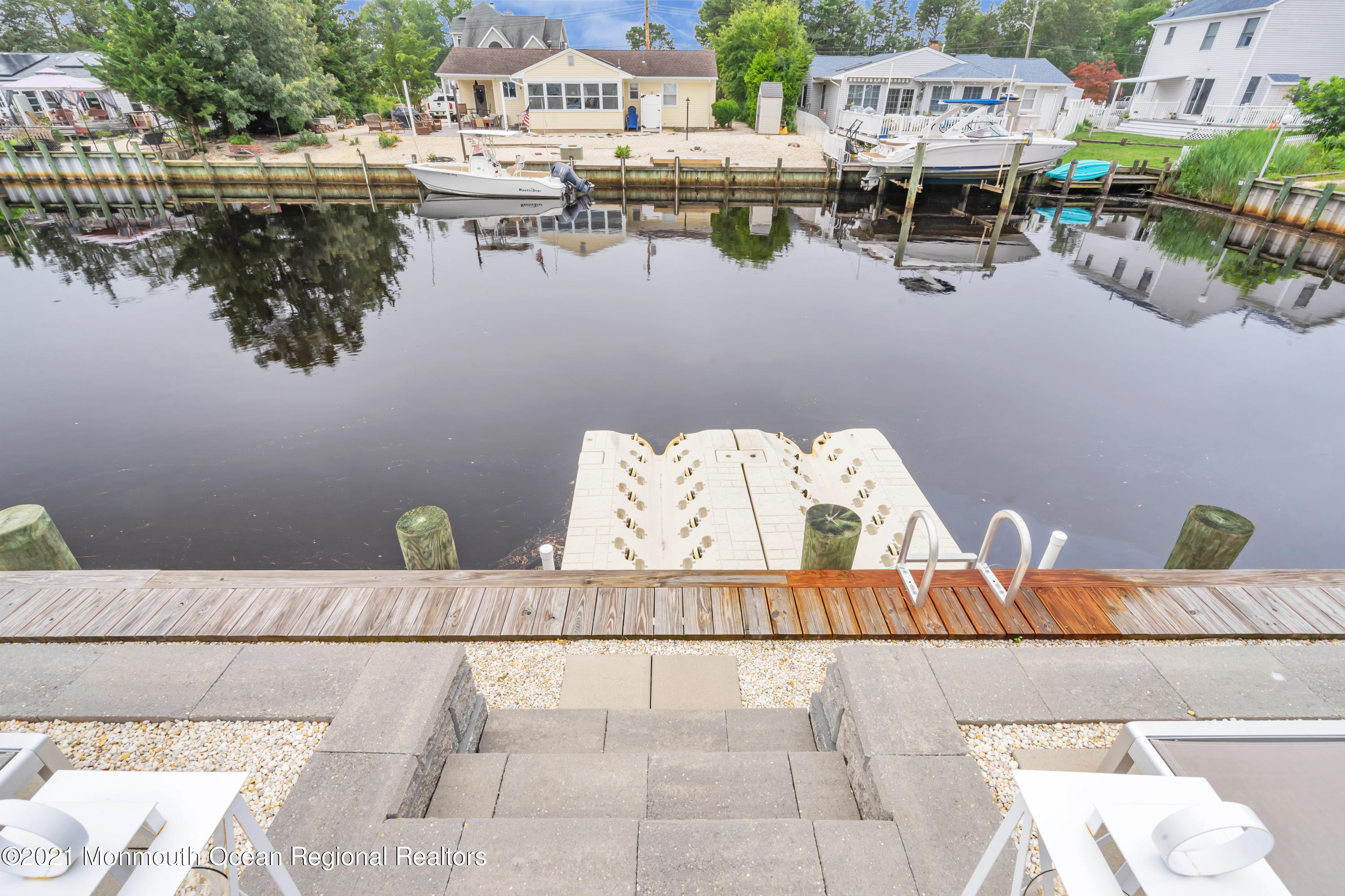 28 Harbor Inn Road Bayville, NJ 08721 - Photo 45 of 52 a front view of a house with outdoor seating