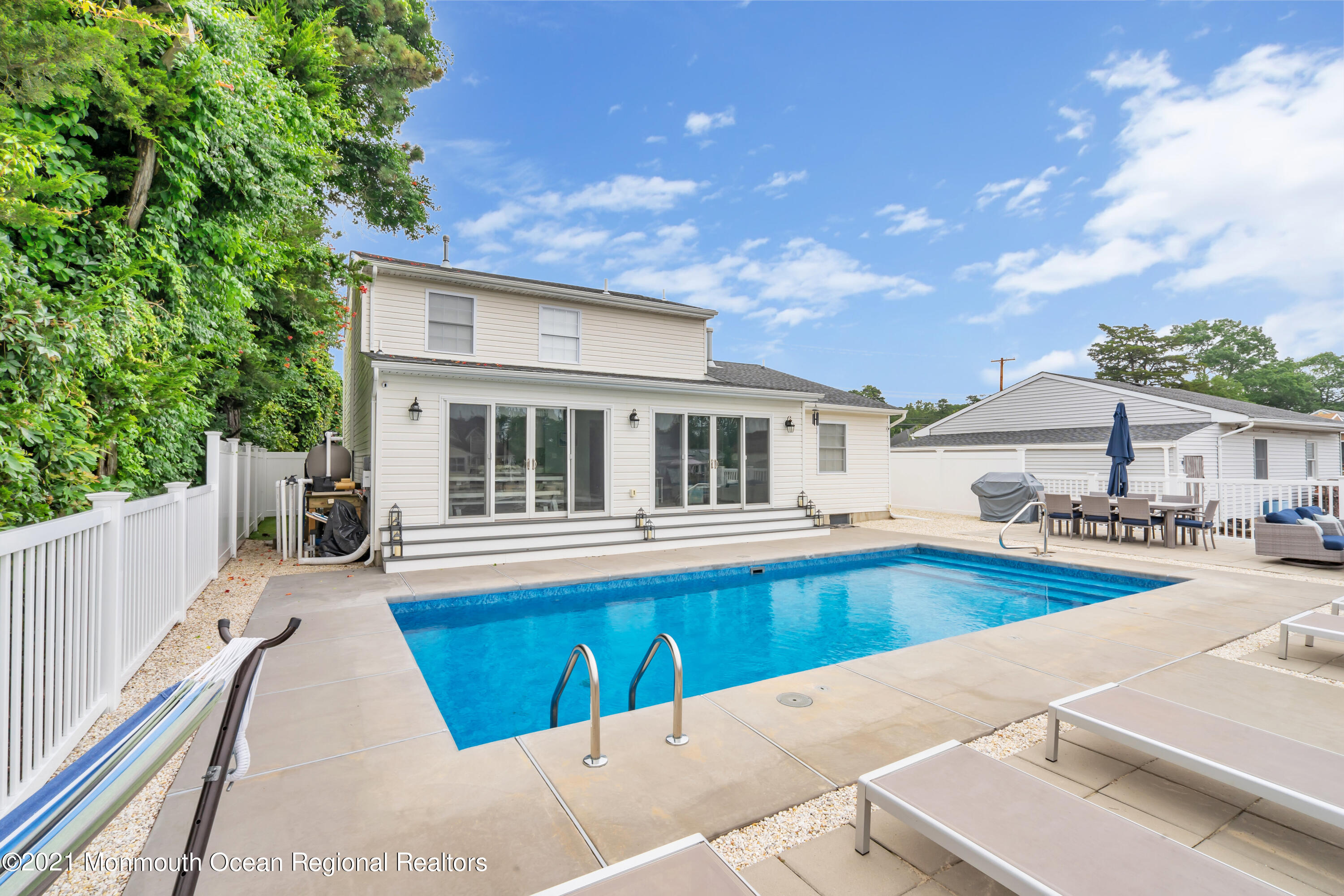 28 Harbor Inn Road Bayville, NJ 08721 - Photo 46 of 52 a view of a house with pool and sitting area