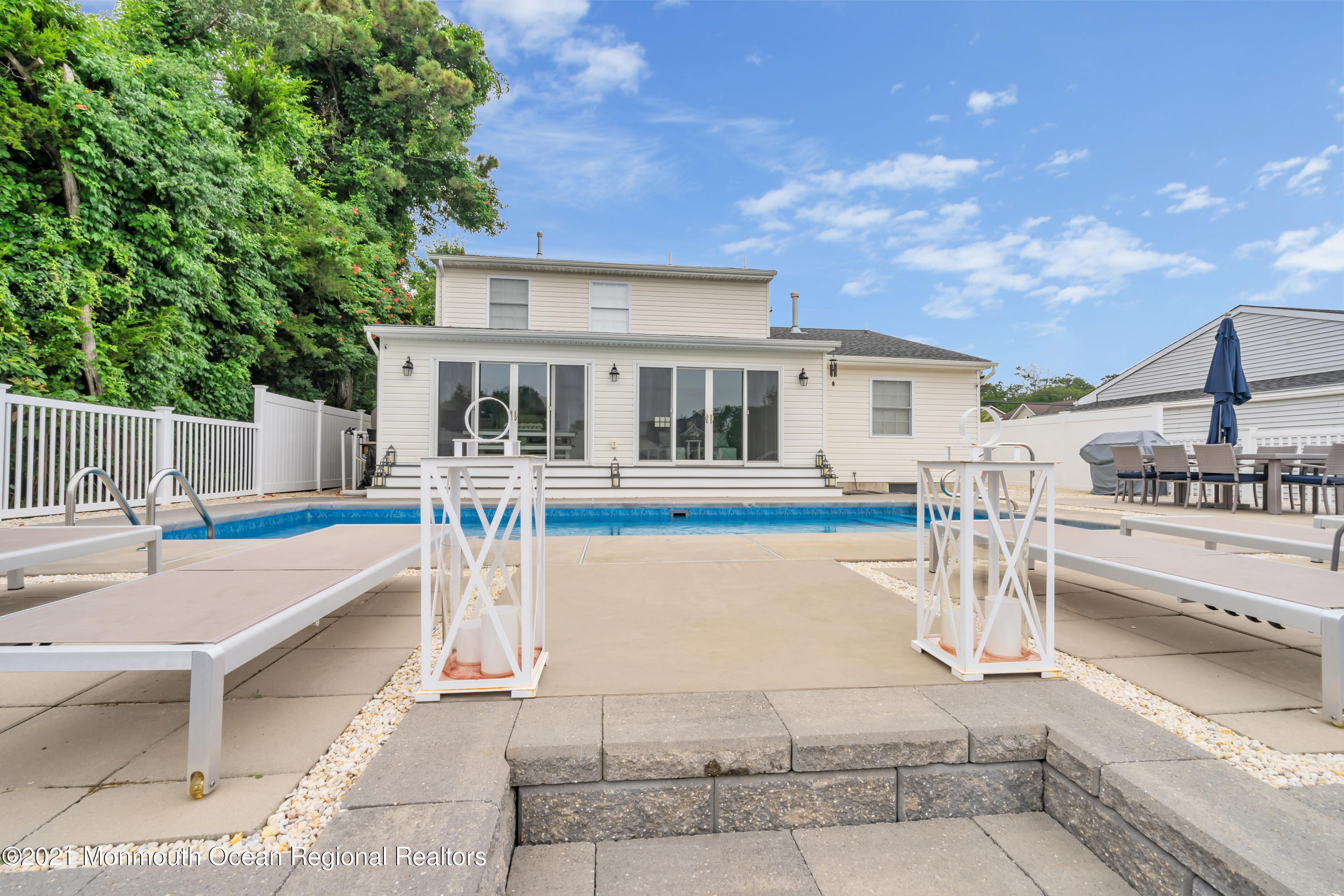 28 Harbor Inn Road Bayville, NJ 08721 - Photo 49 of 52 a view of house with swimming pool and sitting area
