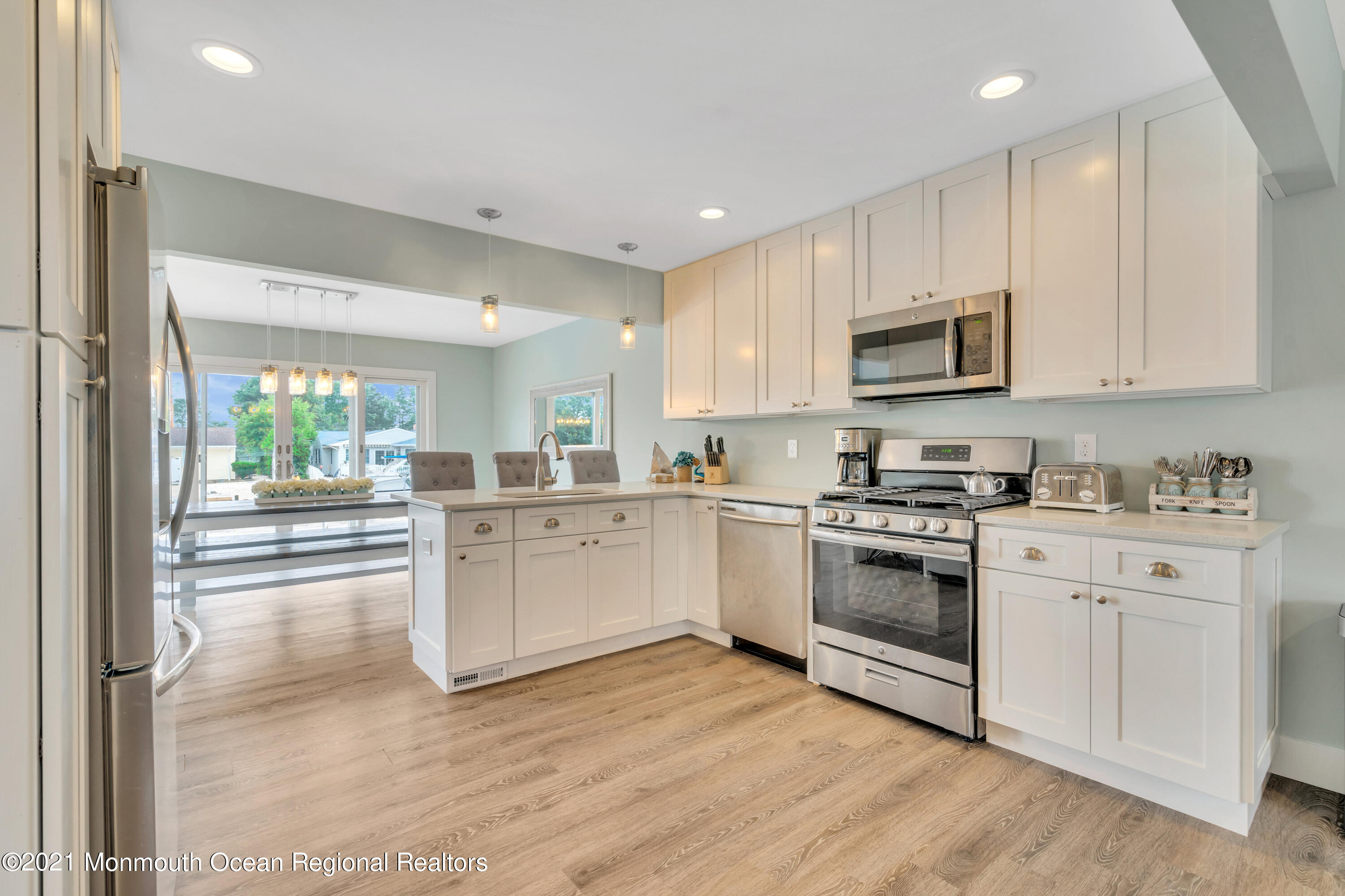 28 Harbor Inn Road Bayville, NJ 08721 - Photo 9 of 52 a kitchen with cabinets stainless steel appliances and a window