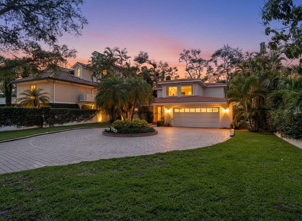 3127 Bay Shore Road Sarasota, FL 34234 - Photo 2 of 78 a view of a house with a yard and a street