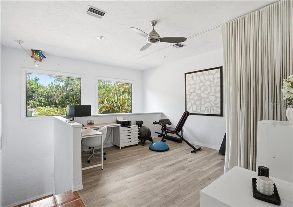 3127 Bay Shore Road Sarasota, FL 34234 - Photo 40 of 78 a work room with furniture and a window