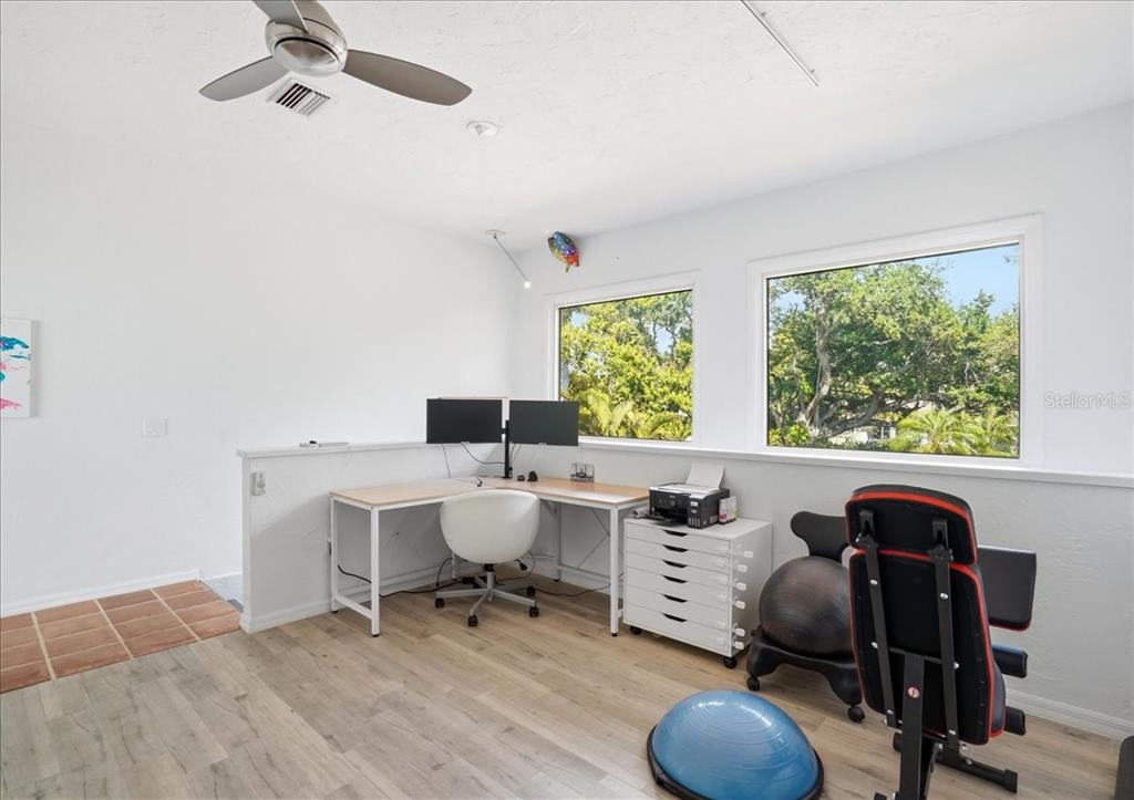 3127 Bay Shore Road Sarasota, FL 34234 - Photo 41 of 78 a view of a workspace with furniture and a window