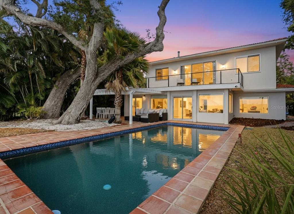 3127 Bay Shore Road Sarasota, FL 34234 - Photo 56 of 78 a view of a swimming pool with a patio