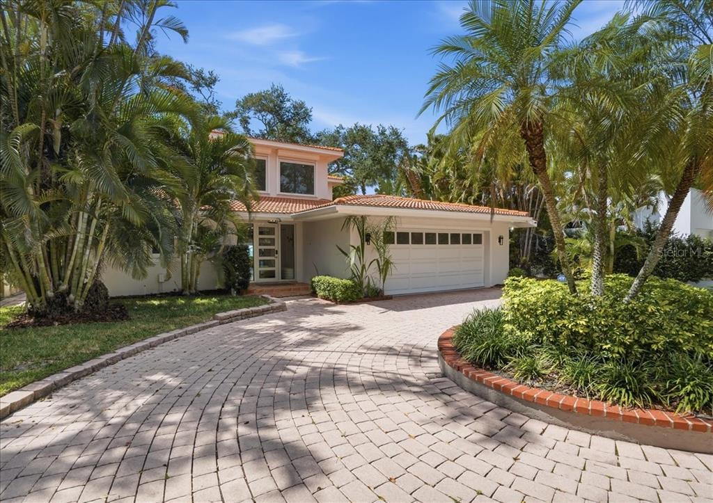 3127 Bay Shore Road Sarasota, FL 34234 - Photo 6 of 78 a front view of a house with a garden