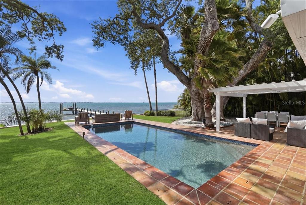 3127 Bay Shore Road Sarasota, FL 34234 - Photo 73 of 78 a view of a house with swimming pool and sitting area
