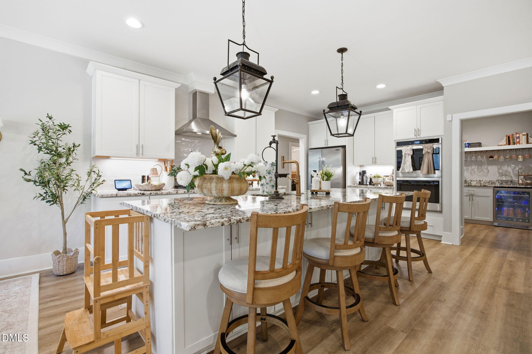 3511 Bruce Garner Road Wake Forest, NC 27587 - Photo 10 of 56 a very nice looking kitchen with a dining table chairs sink and cabinets