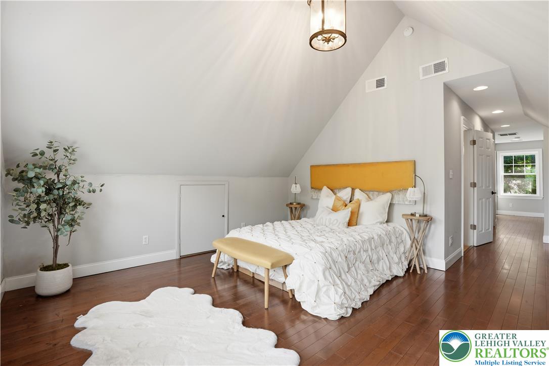 2014 Linden Street Bethlehem, PA 18017 - Photo 33 of 85 Slanted ceilings and rich hardwood flooring create a cozy, unique bedroom atmosphere.