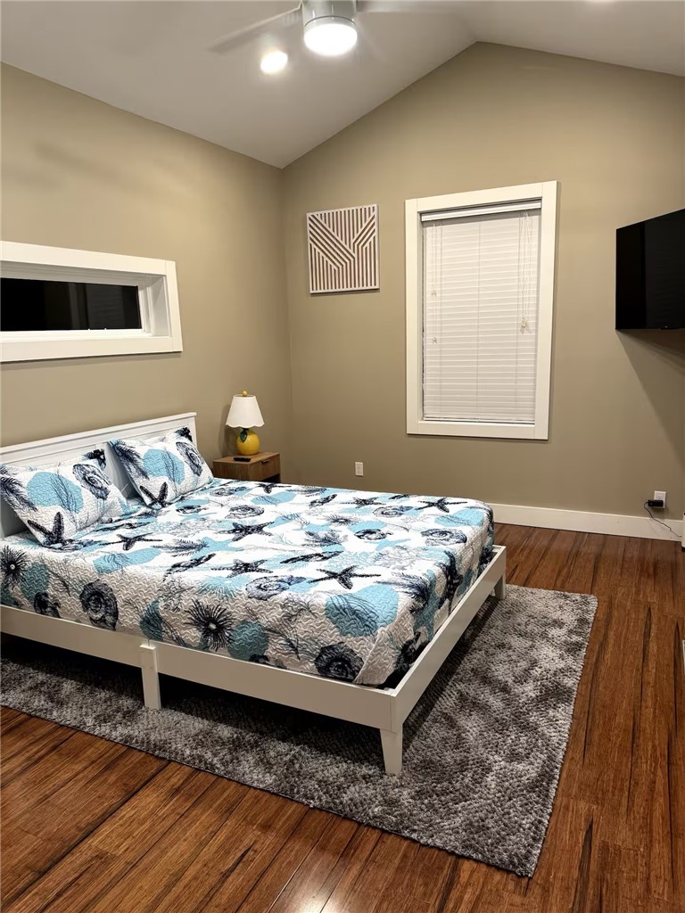 14310 Ridley Way Corpus Christi, TX 78418 - Photo 13 of 19 a bedroom with a bed and wooden floor