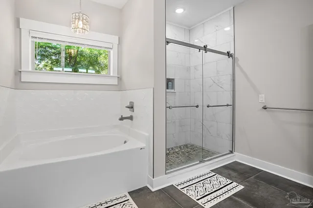 a bathroom with a bathtub and a shower