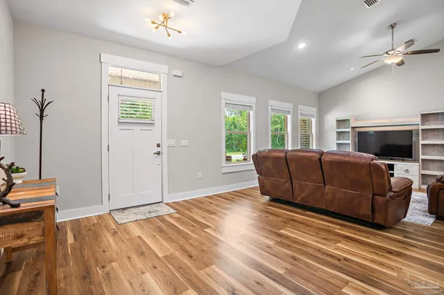 a living room with a couch and a flat screen tv