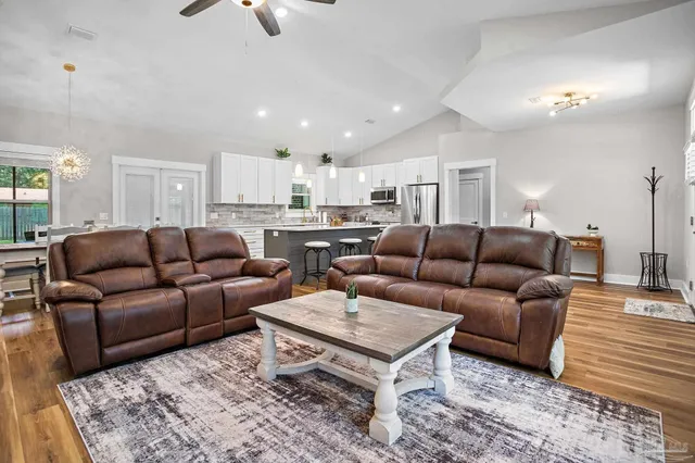 a living room with furniture and a rug