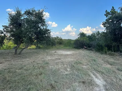 a view of a lake with a yard