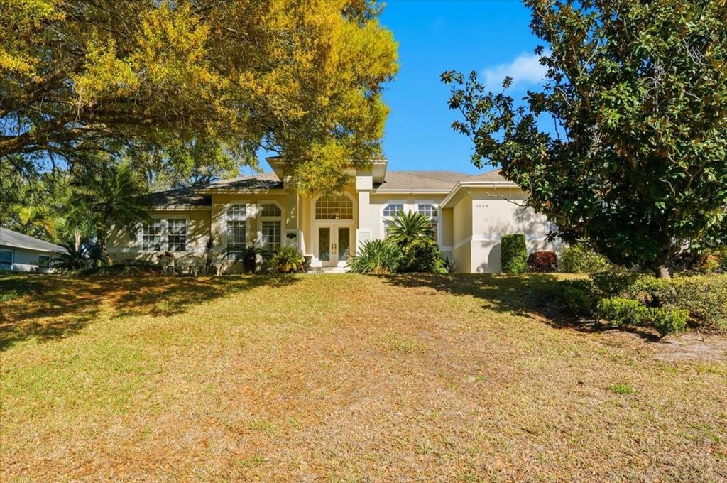 a front view of a house with a yard