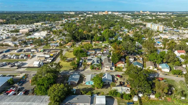 an aerial view of residential houses with city view