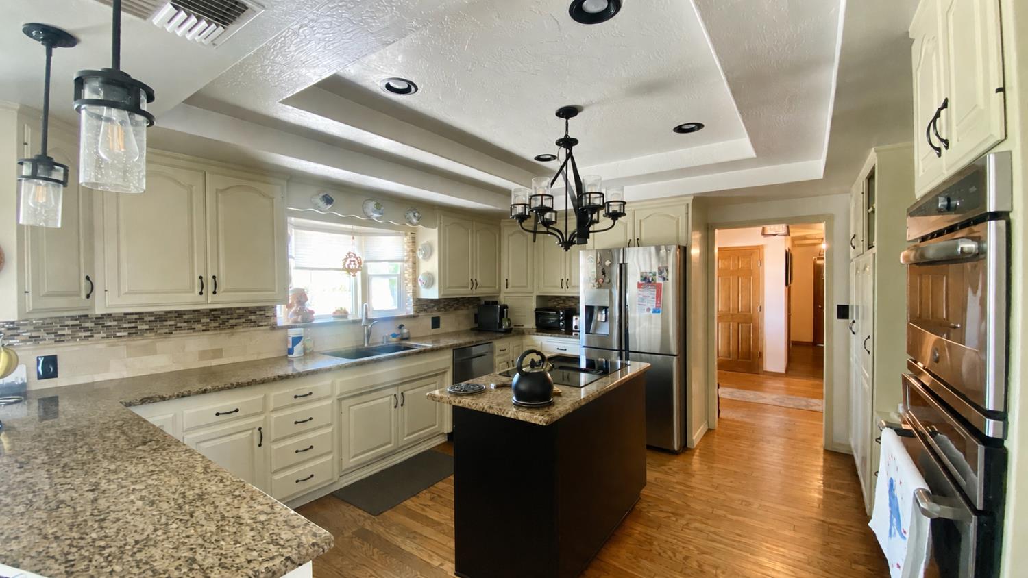 5012 Ustick Road Modesto, CA 95358 - Photo 15 of 26 a kitchen with stainless steel appliances granite countertop a sink stove and refrigerator
