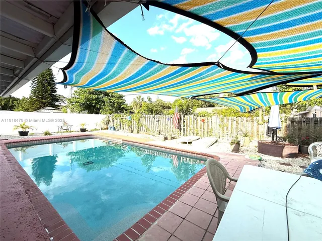 a view of a swimming pool with a patio