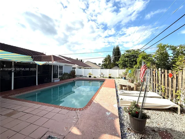 a view of a patio with couches chairs and potted plants