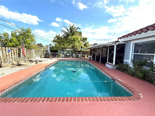 a view of a swimming pool with a patio