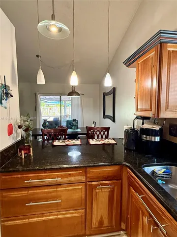 a kitchen with sink and window