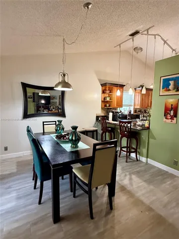 a view of a dining room with furniture