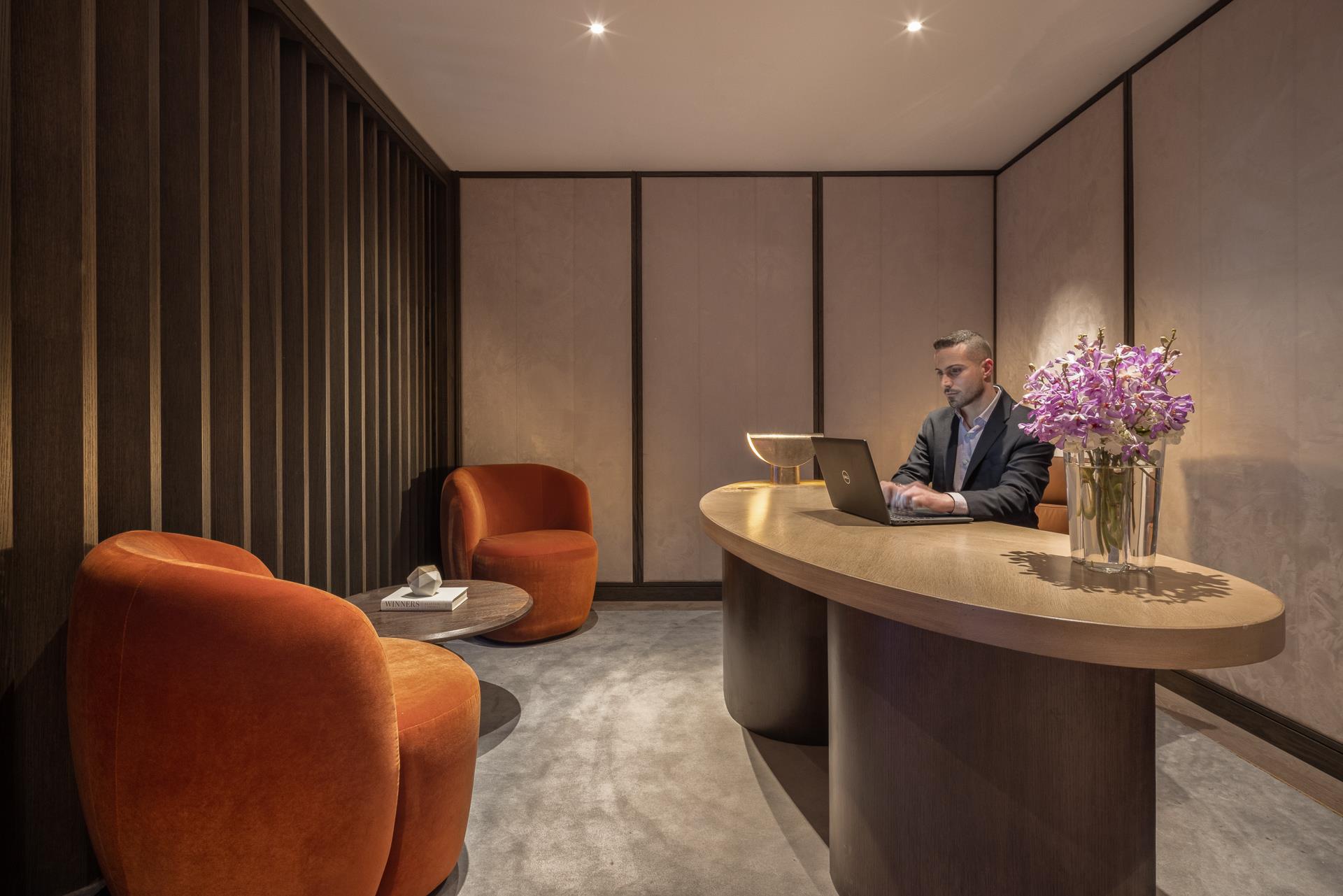 111 West 56th Street, Unit 41K Manhattan, NY 10019 - Photo 11 of 13 a dining room with furniture and flowers