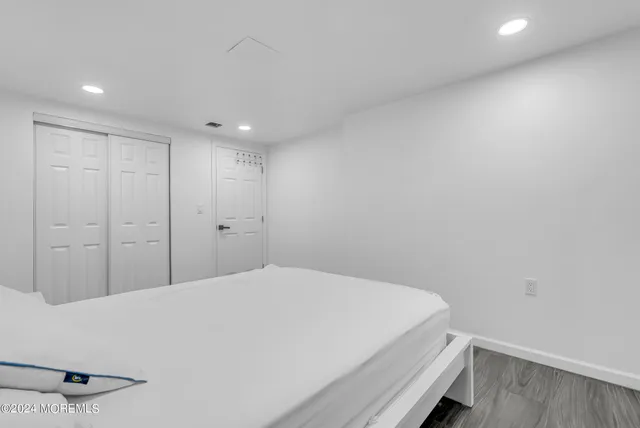 a bedroom with a bed and a desk