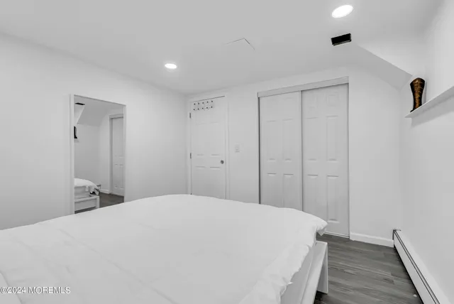 a large white bed in a white room