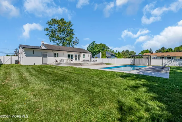 a view of house with outdoor space and sitting area