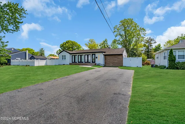 a view of a house with garden and deck