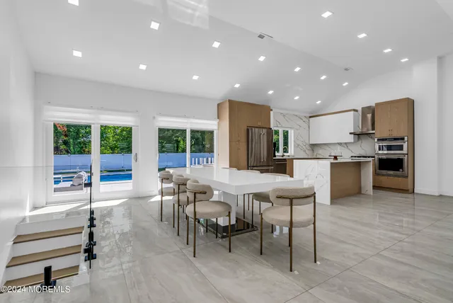 a kitchen with a table and chairs in it