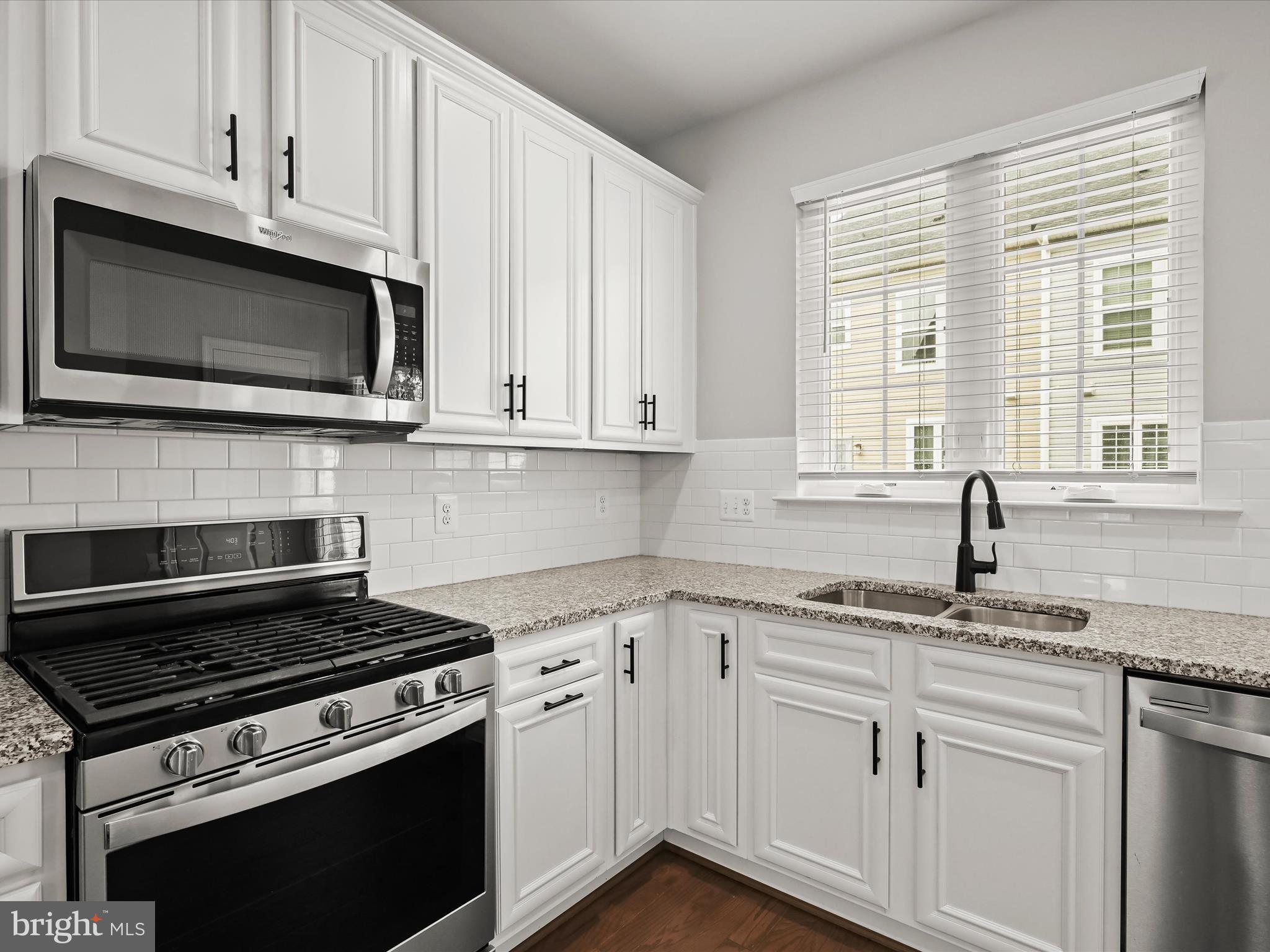 2612 Hardaway Circle Hanover, MD 21076 - Photo 11 of 29 a kitchen with cabinets appliances a sink and a window