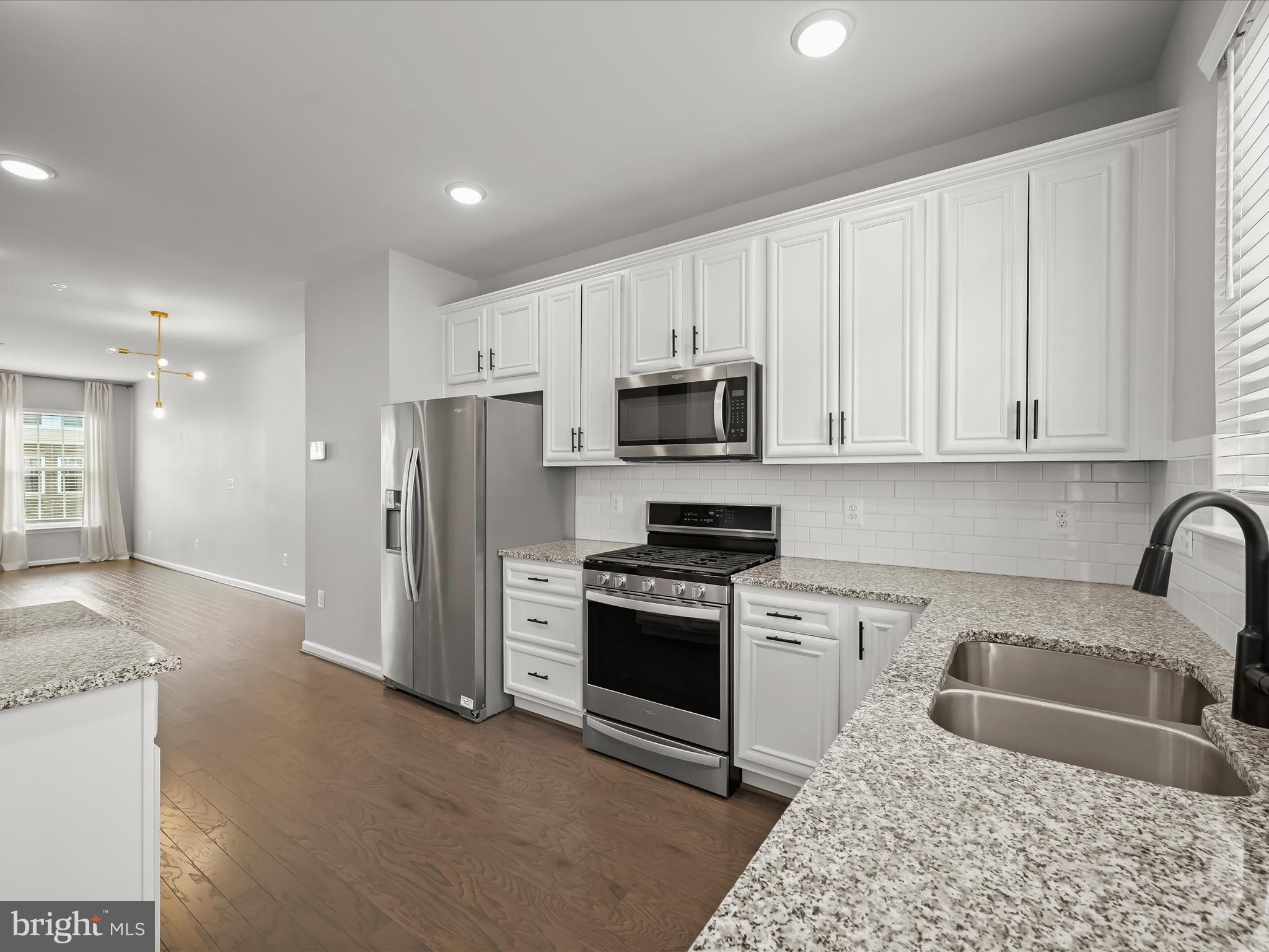 2612 Hardaway Circle Hanover, MD 21076 - Photo 13 of 29 a kitchen with stainless steel appliances granite countertop a refrigerator sink and stove