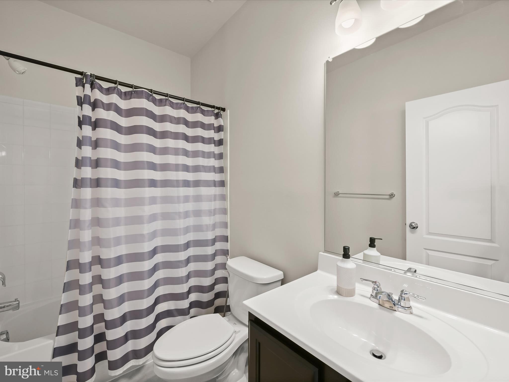 2612 Hardaway Circle Hanover, MD 21076 - Photo 17 of 29 a bathroom with a sink toilet and shower