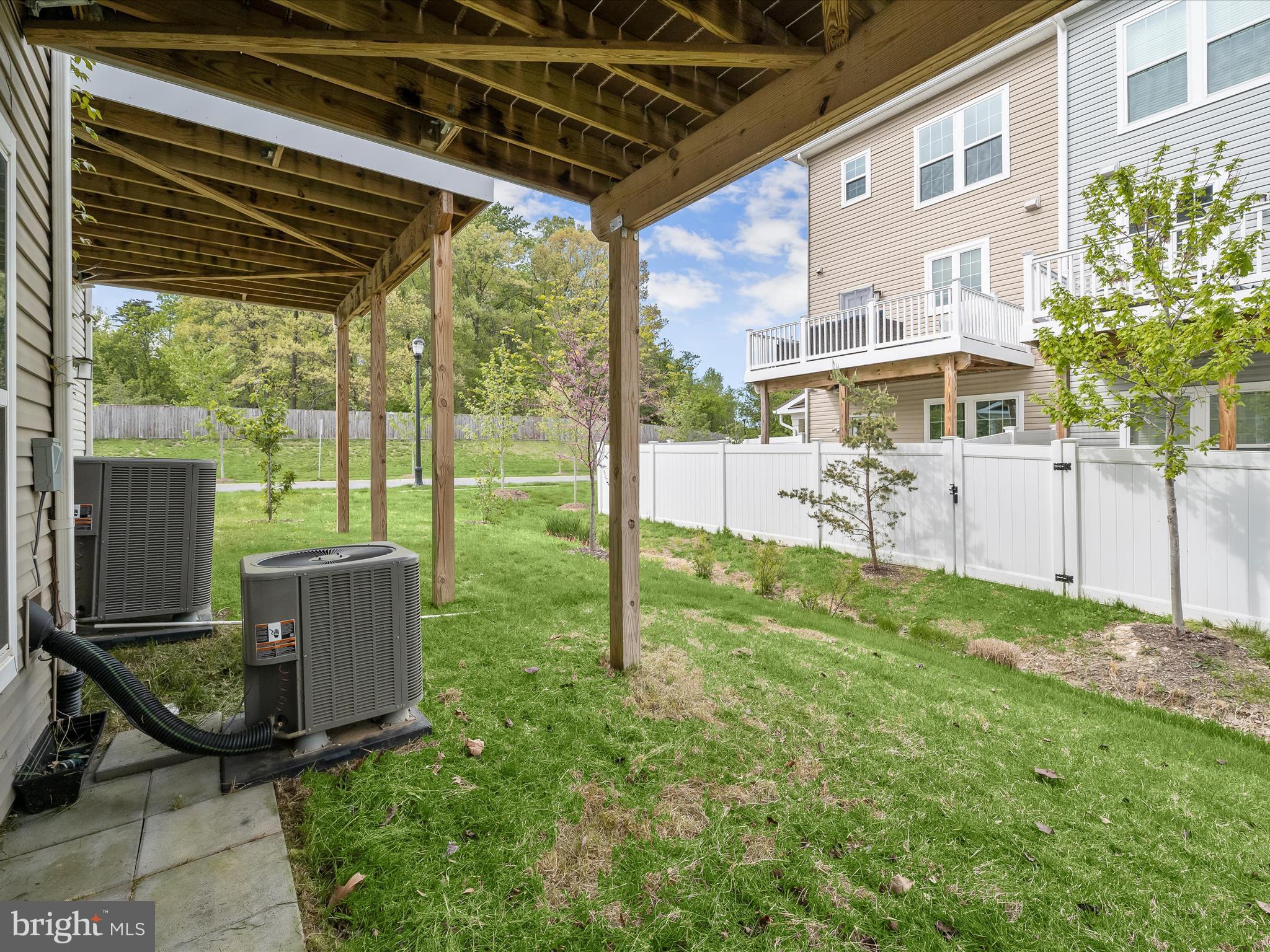 2612 Hardaway Circle Hanover, MD 21076 - Photo 27 of 29 a view of a porch with a table and chairs under an umbrella