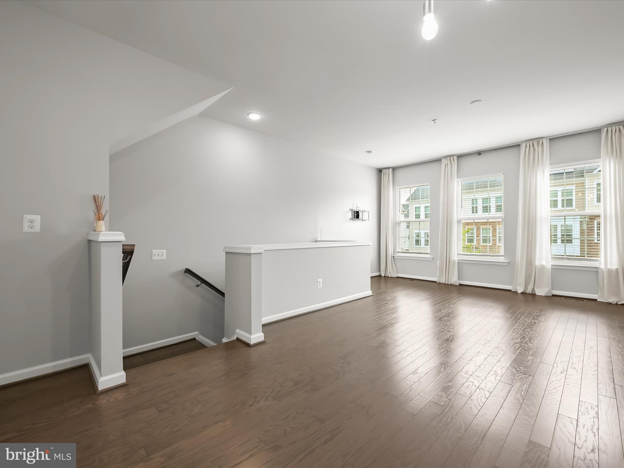 2612 Hardaway Circle Hanover, MD 21076 - Photo 3 of 29 a view of an empty room with a window and wooden floor