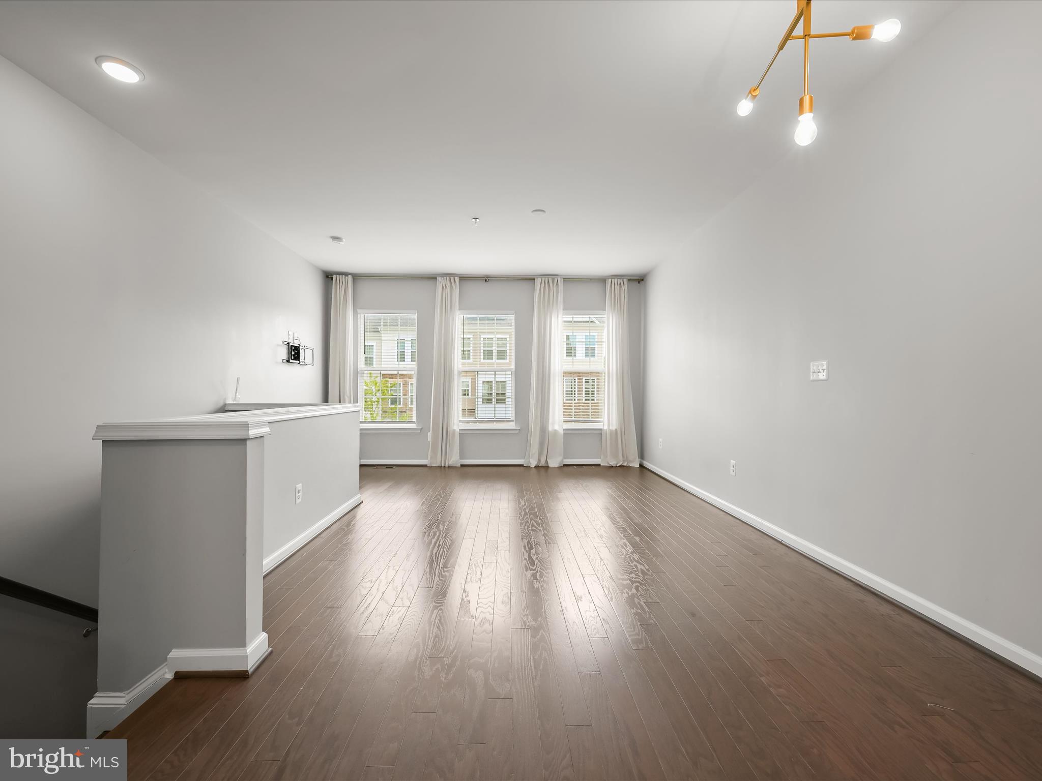 2612 Hardaway Circle Hanover, MD 21076 - Photo 4 of 29 an empty room with wooden floor and windows